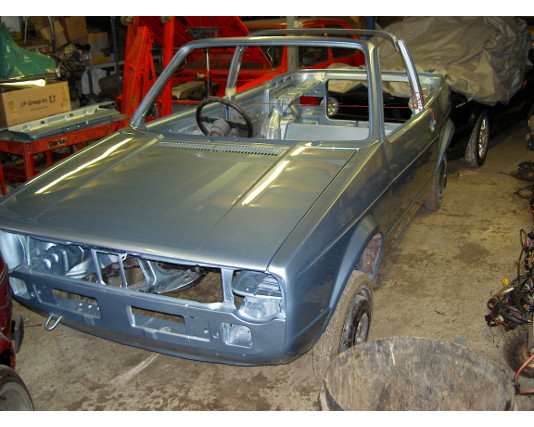 Mk1 cabriolet shell in grey primer in the workshop