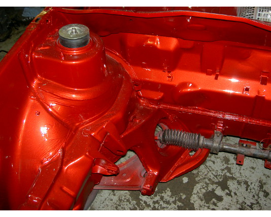Freshly painted red inner wing and strut top