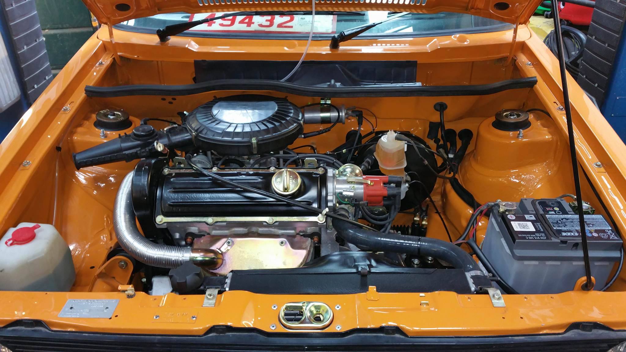 Restored orange Mk1 engine bay with the engine back in